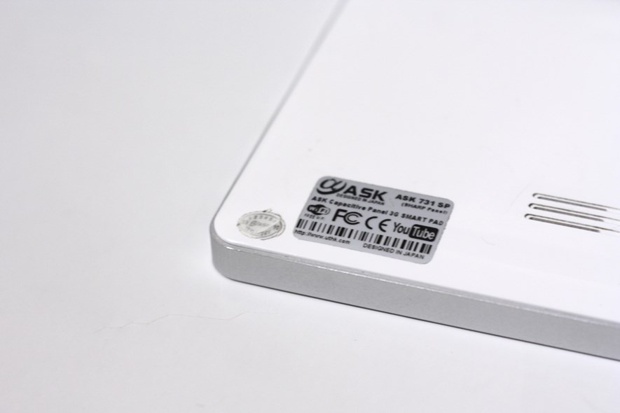 The Warranty Void-screw is found under the small sticker.