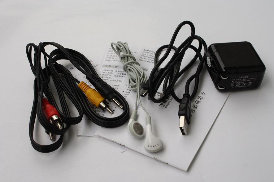RCA-cables, a pair of headphones, a USB cable and a USB charger.