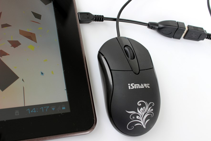 A mouse connected via the USB host port, using the provided adapter cable (which keeps falling out). The black-and-blue mouse cursor is visible on the screen.