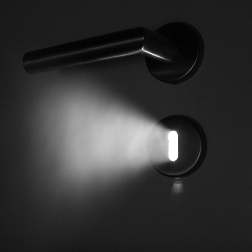 Light shining through keyhole and steam.