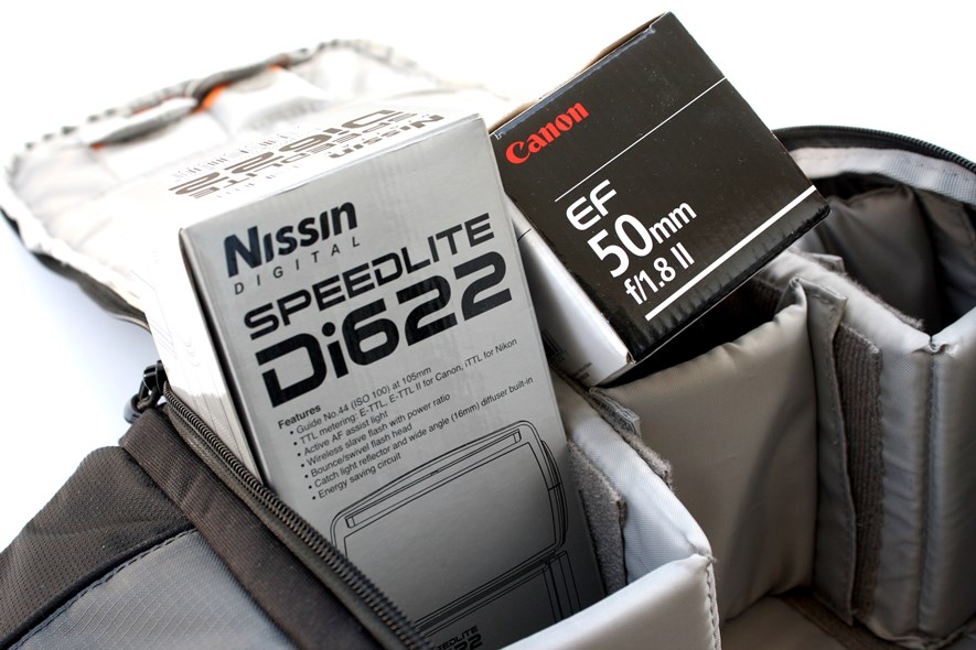 Canon 50 mm f/1.8, Nissin Speedlite Di622, and the Lowepro 202AW.