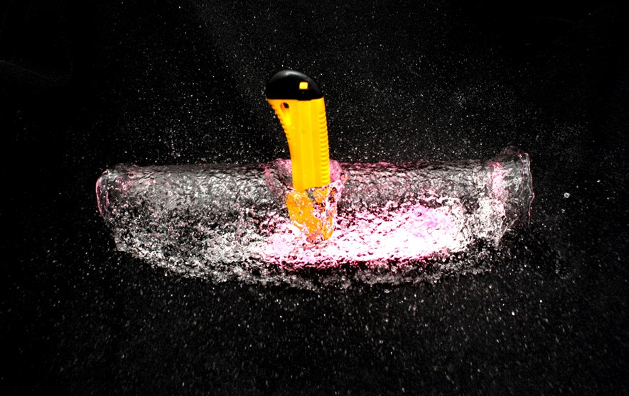 A balloon filled with water bursting.