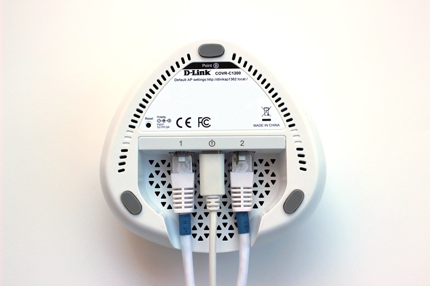 The back of the unit. It has no mounting holes and no obvious way to mount it on a wall. Two ethernet cables can be connected to the unit. This is the primary unit, meaning one cable is connected to the 