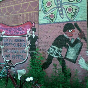 Christiania. It&#039;s still 1970 around here. On the wall: &quot;When I hear the word culture, I release the safety of my gun.&quot;